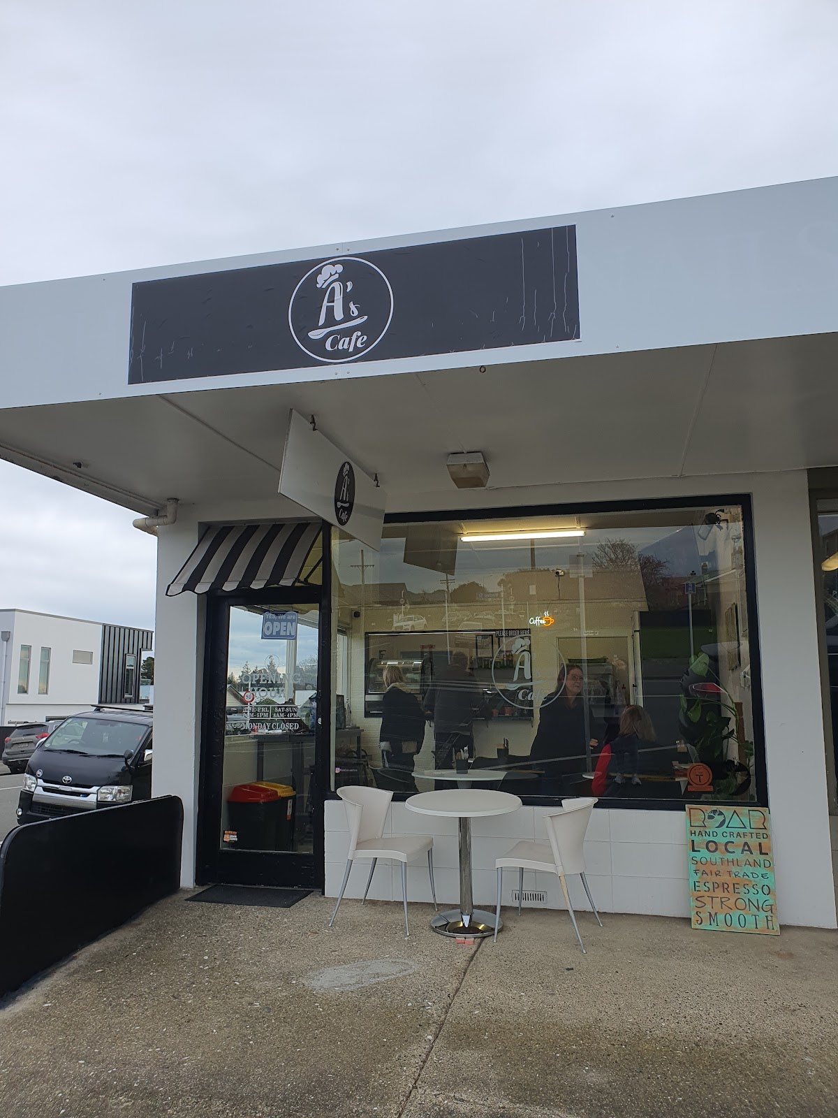 The A's Cafe shopfront on Windsor Street with its black and white roundel sign