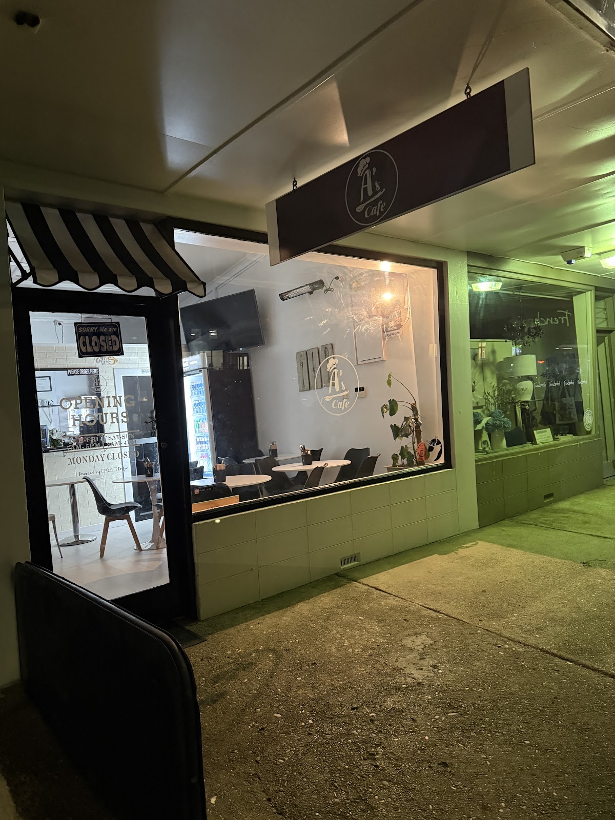 A's Cafe lit up at night on Windsor Street